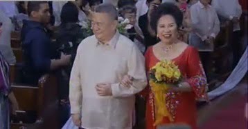 Senator Miriam Defensor Santiago walking in the aisle with her husband Narciso Santiago